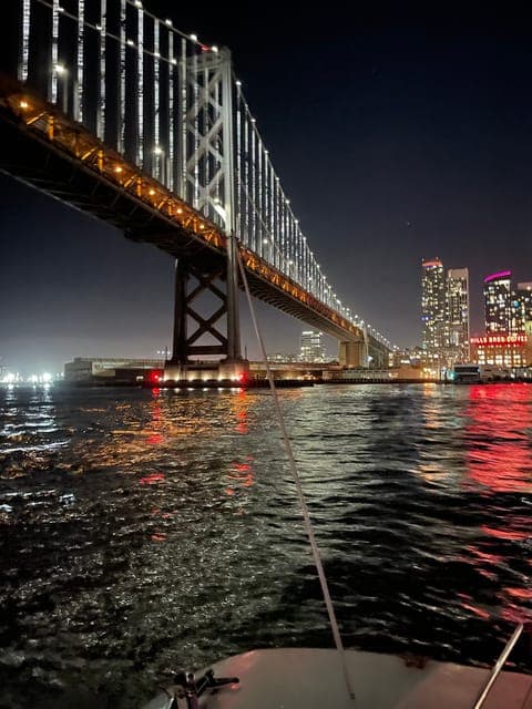 16. City Lights Sail Under the Full Moon - Image 16